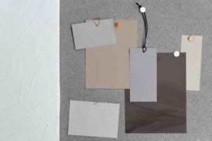 Neutral paint colors on a selection board, including beige and gray.