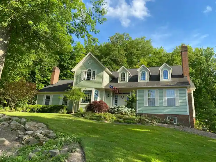 Exterior house painting in Aurora, Ohio focused on siding and trim refresh by local painting contractors