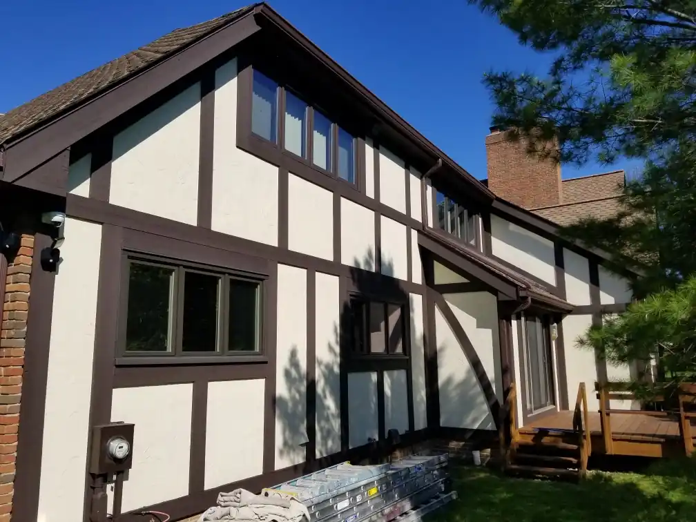 Exterior painting near me in Aurora, Ohio for detailed trim lines and clean siding contrast