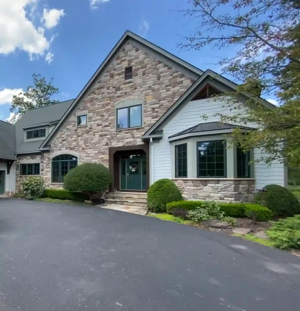 Exterior house painting in Avon Lake, Ohio with detailed trim and entry accents