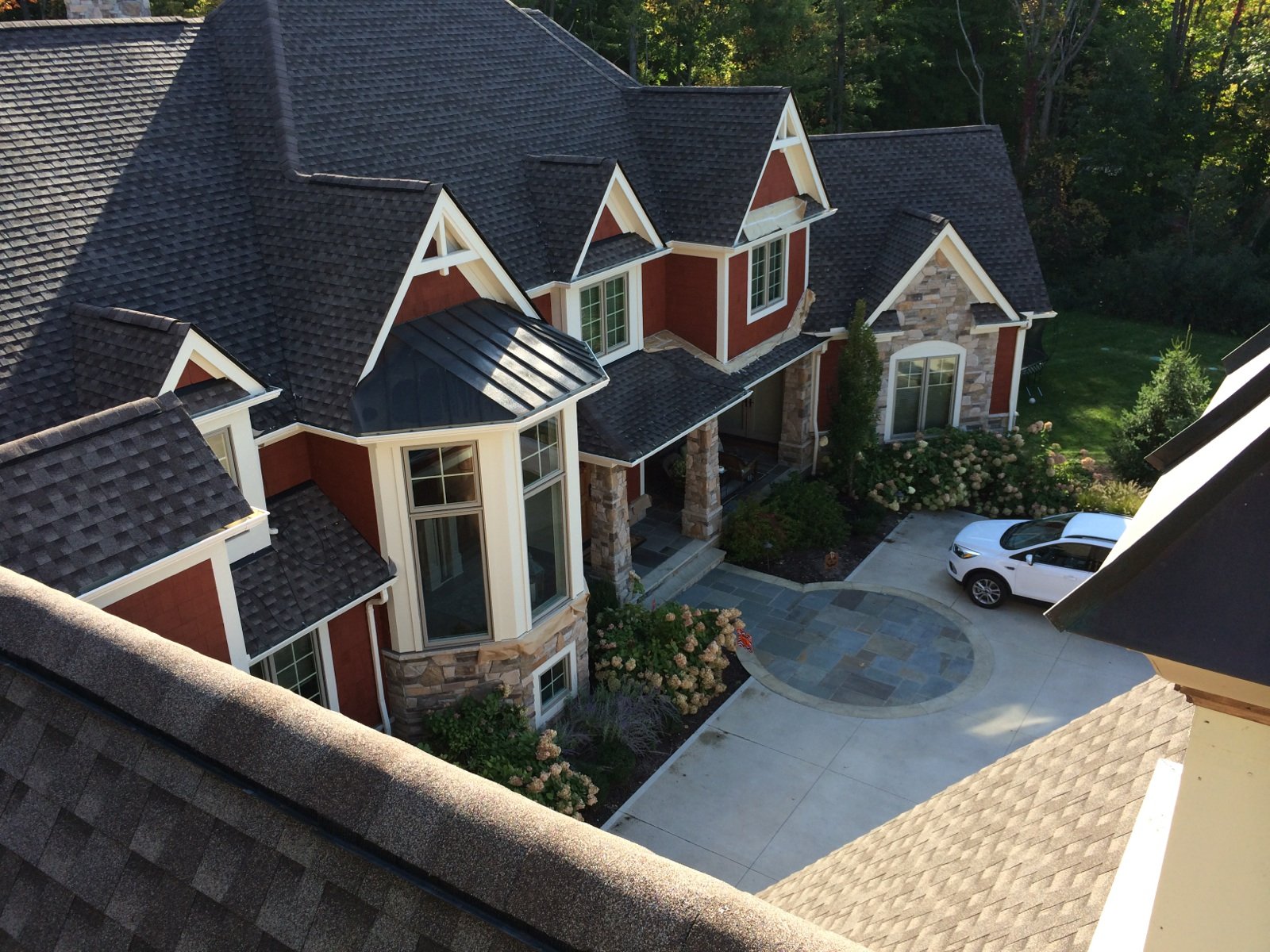 Exterior home painting project in Avon, Ohio by CFalls Painting, showcasing a newly painted two-story house.