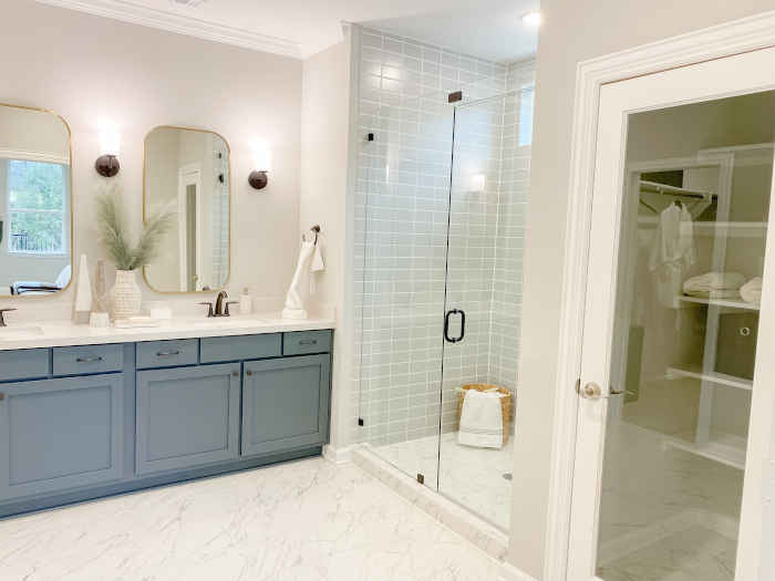 Freshly painted bathroom vanity cabinets in a clean, blue finish.