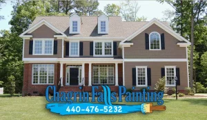 Two-story home with tan siding and brick facade representing house painting services in Brecksville, Ohio by Chagrin Falls Painting Company