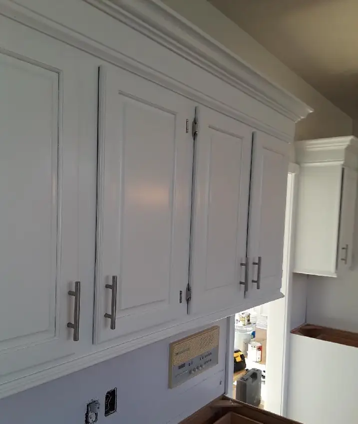 Cabinet painting in North Olmsted, OH, smooth white cabinet finish with durable coating and clean hardware detail