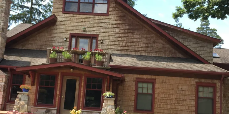 Cedar-shake home and patio after a house wash, siding washing in Auburn, Ohio