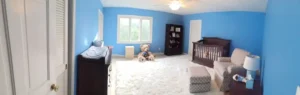 Professional interior house painting in Cleveland featuring a blue nursery with detailed trim work.