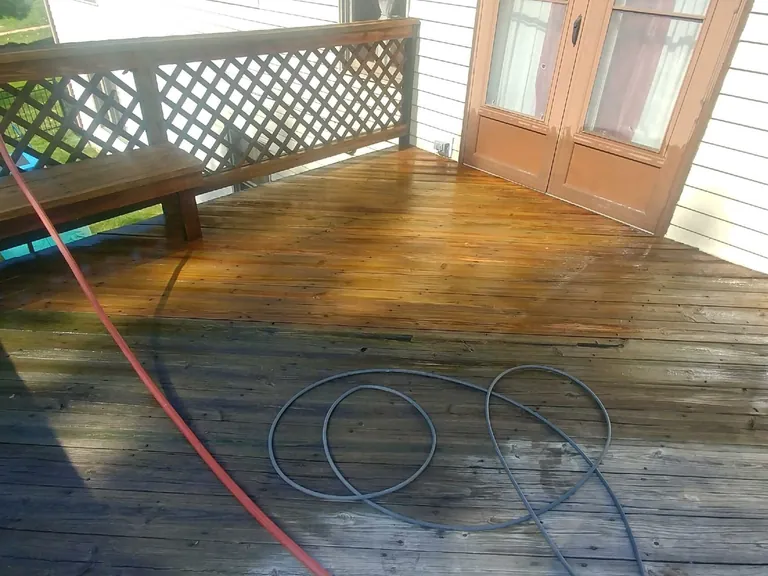 Wood deck half washed showing the gray before and clean after, deck power washing in Beachwood, Ohio