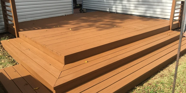 Backyard deck and steps after refinishing in a cedar-tone solid stain in Brecksville, Ohio
