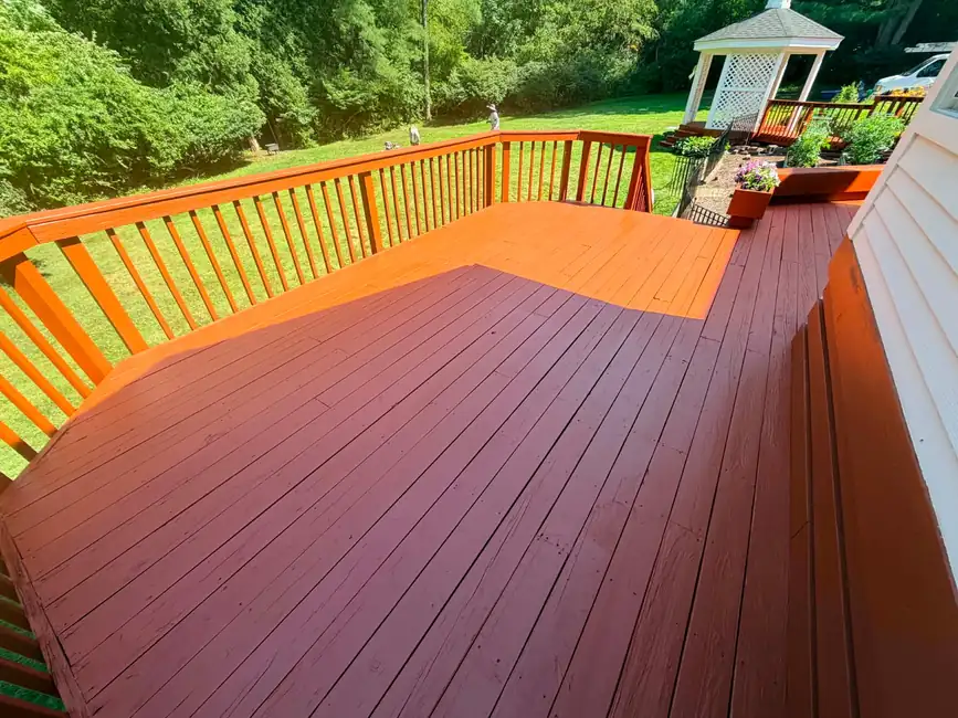Professionally refinished deck with fresh redwood solid stain in Northeast Ohio