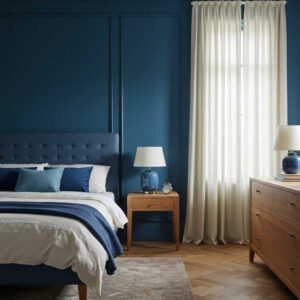 deep blue bedroom promoting tranquility through rich paint color