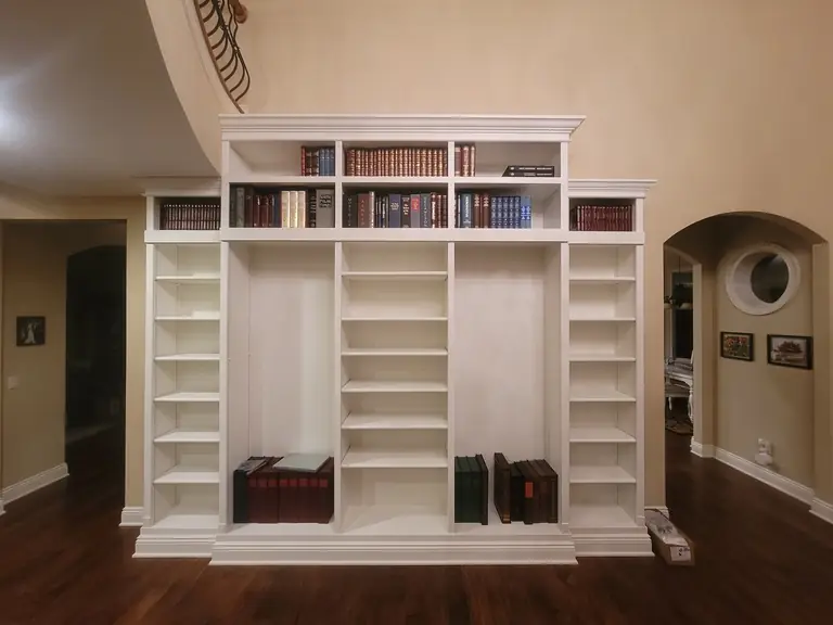 Floor-to-ceiling built-in bookcase painted white by Chagrin Falls Painting, Northeast Ohio