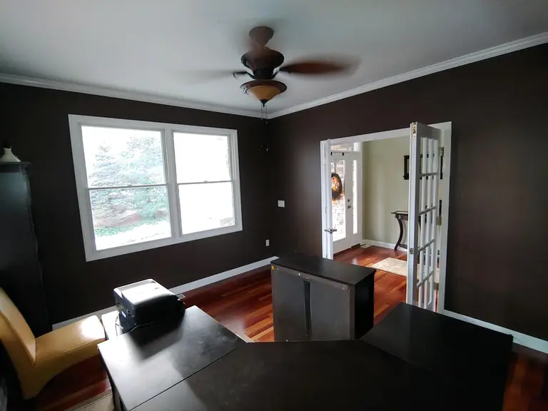 Dark accent walls with white trim and crown molding, interior painting in Northeast Ohio