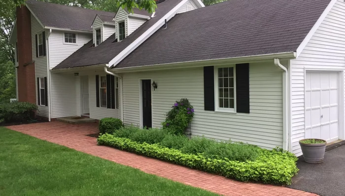 Home exterior and brick walkway cleaned by pressure washing in Hudson, Ohio