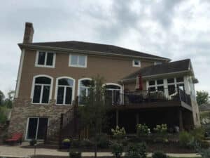 Professional house painter in Bath, Ohio, working on an exterior home project.