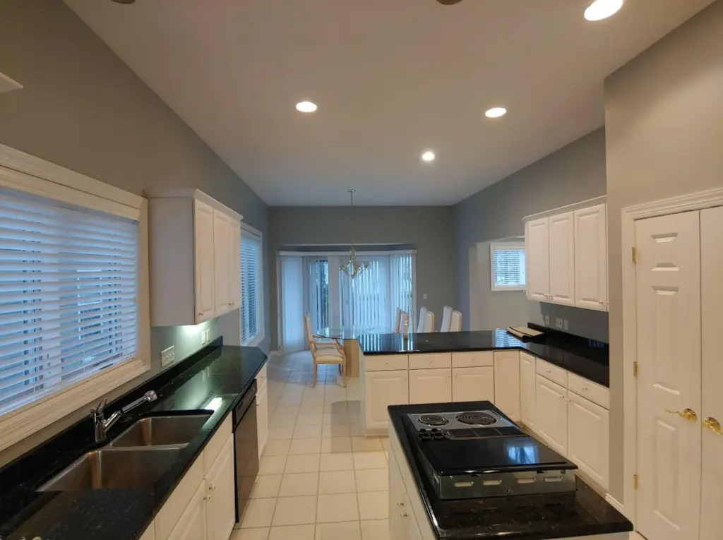 interior kitchen ceiling and wall painting with recessed lighting