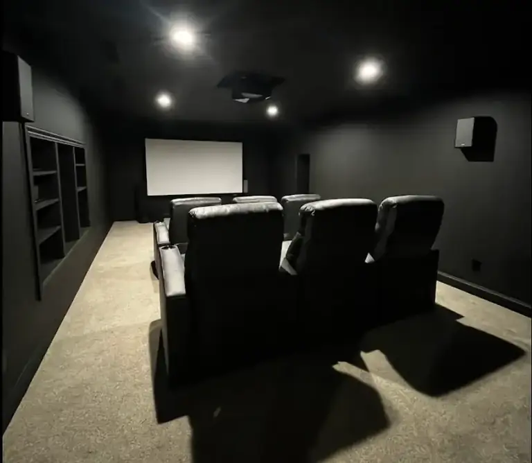 Home theater room painted with dark walls and ceiling, interior painting in Northeast Ohio
