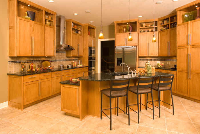 Light oak kitchen cabinets refinished to enhance their natural grain and elegance.