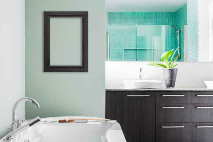 A modern bathroom with freshly painted walls and trim.