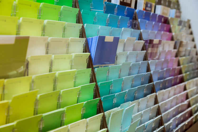 A collection of paint swatches showcasing Sherwin-Williams' extensive color palette and commitment to innovation.