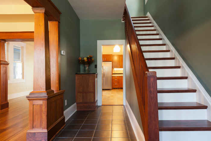 Painted entryway with fresh house interior paint and stairs.