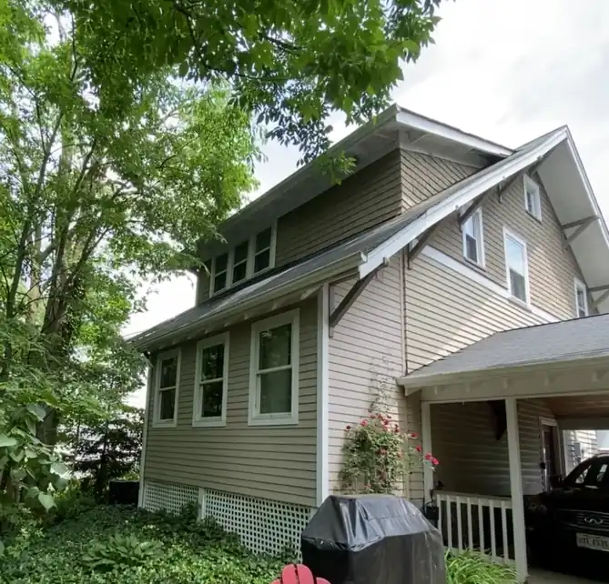 Exterior house painting in Parma OH on siding and trim with even color and sharp edges