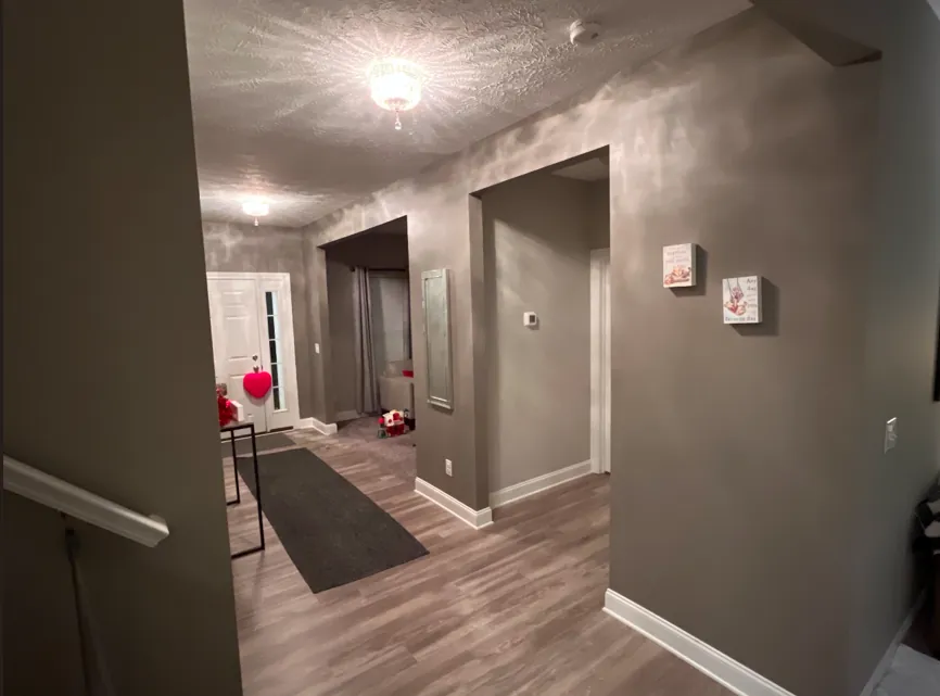 Interior painting in Parma OH hallway walls and trim with smooth color and clean edges