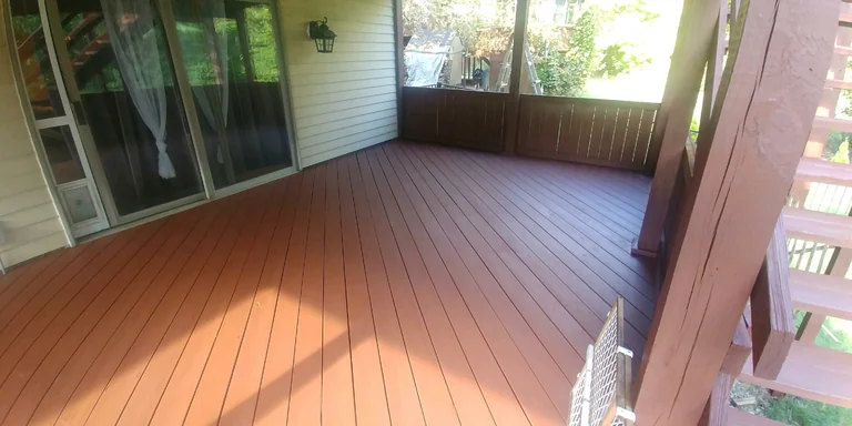 Screened porch deck floor stained red-brown in Twinsburg, Ohio