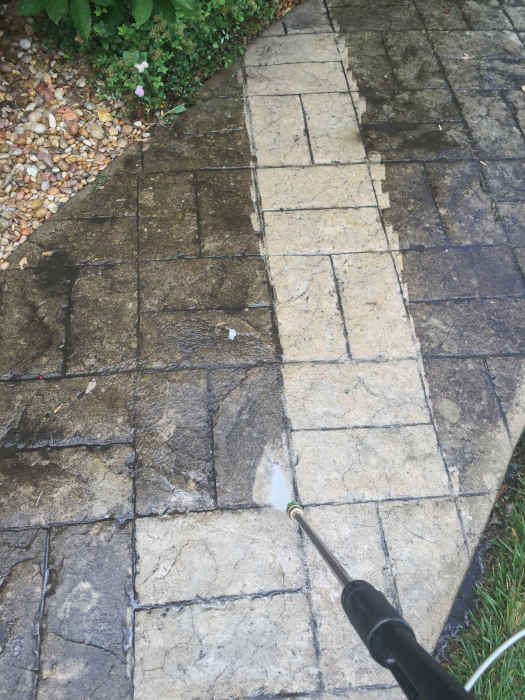 Professional patio cleaning using a power washer near me.