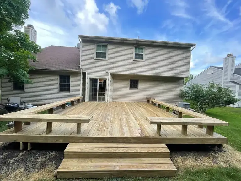 New pressure-treated deck with built-in benches prepped for stain, Northeast Ohio
