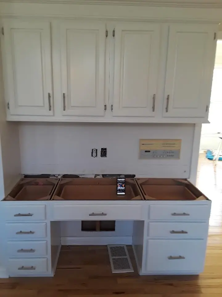 Built-in desk and upper cabinets refinished in white by Chagrin Falls Painting, Northeast Ohio