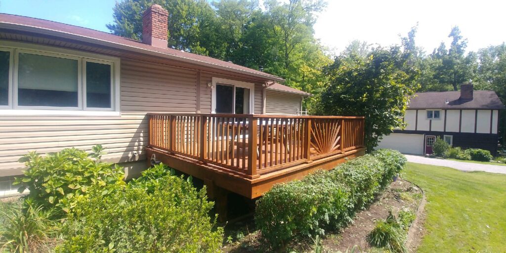 Restored deck on the back of an Avon, Ohio home by CFalls Painting