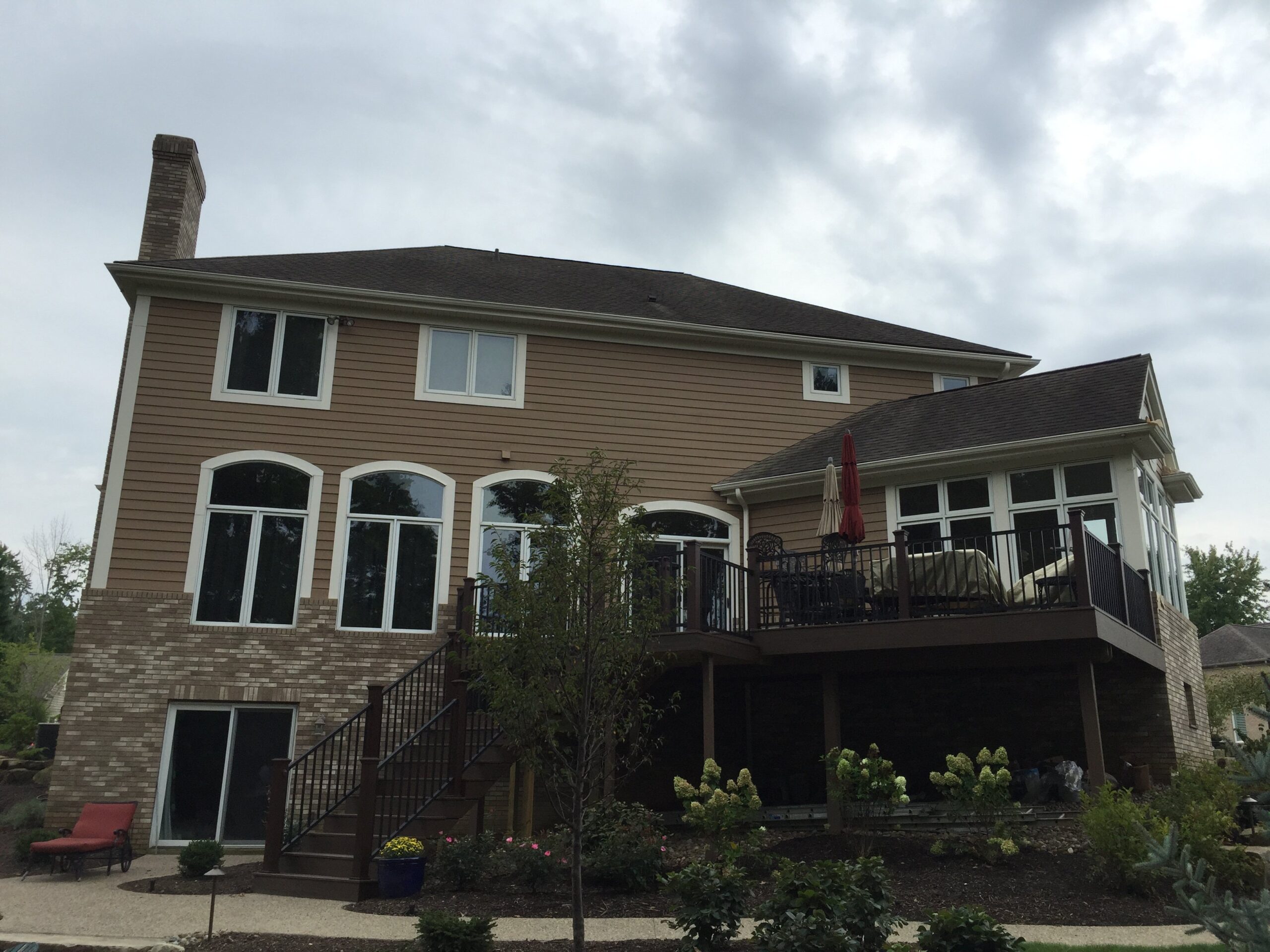 Restored deck on the exterior of a home completed by Chagrin Falls Painting in Bath, Ohio.