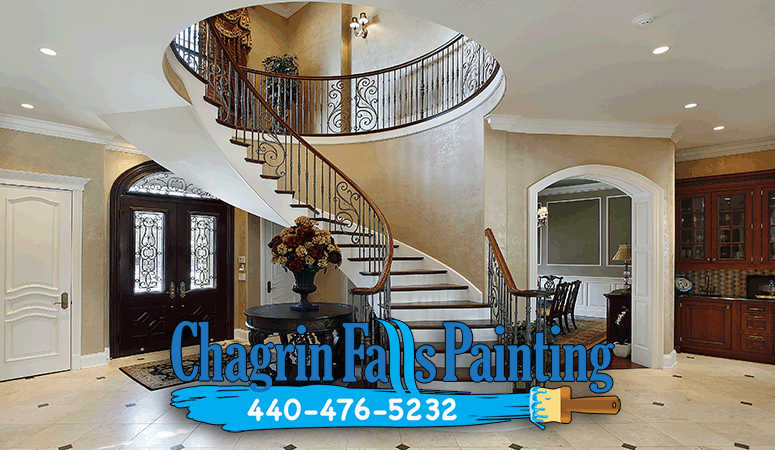 A beautifully painted spiral staircase in a modern entryway.