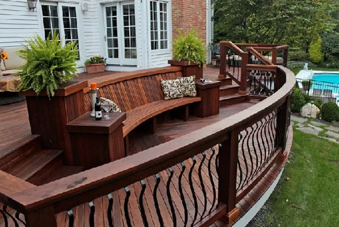 Professionally stained deck with a bench completed by expert painters in Bath, Ohio.