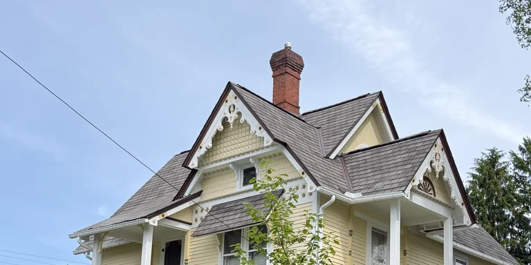 Painted gable trim, balcony and awning on a Victorian home in Garrettsville, Ohio