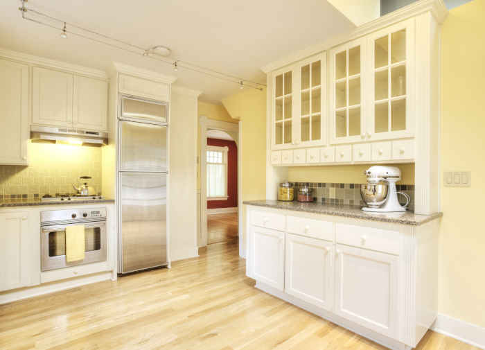 White cabinets transformed with durable cabinet paint, showcasing a sleek and modern finish.