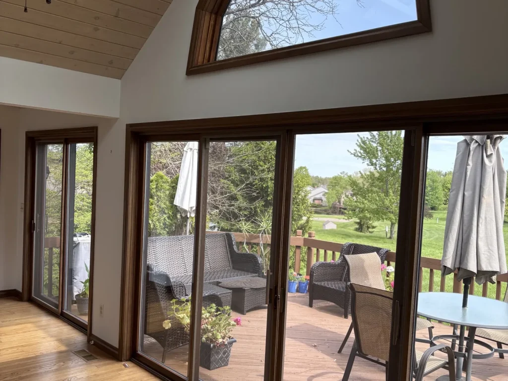 Freshly painted sunroom walls and vaulted ceiling with wood trim in a Bainbridge, Ohio home, whole-house interior painting