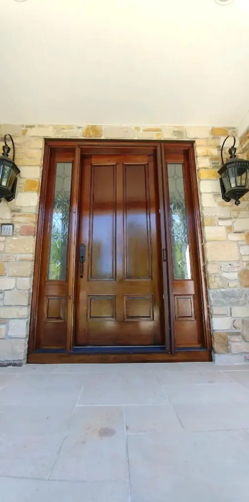 painted wood front door with detailed trim